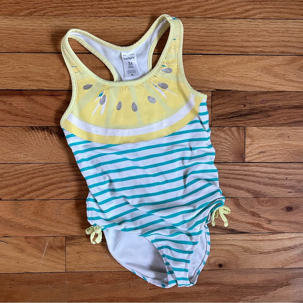 Carter’s size 3T lemon wedge and striped one-piece swimsuit